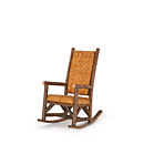 Rustic Rocking Chair with Woven Leather Back #1188 shown in Natural Finish (on Bark) La Lune Collection
